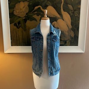 Distressed denim vest